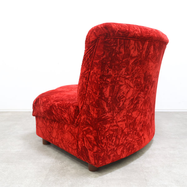 赤いベロア張りのコーナーソファ