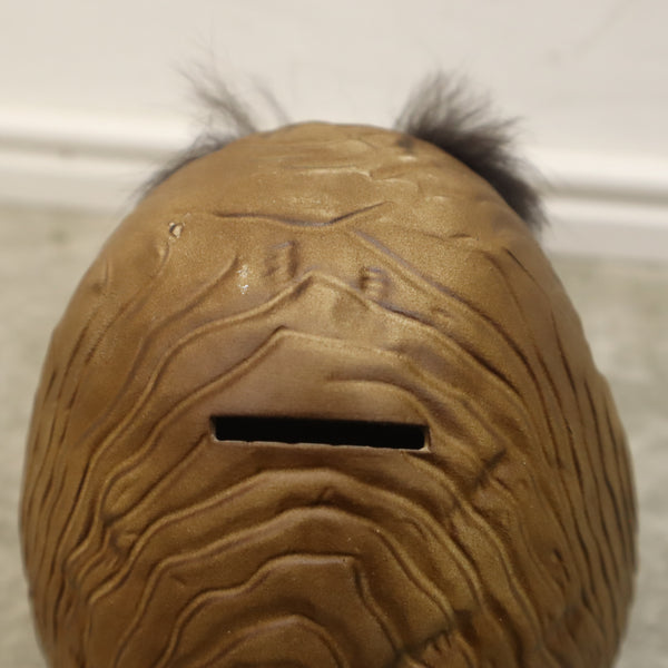 ふわふわ眉毛のだるまの貯金箱